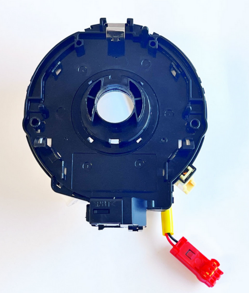 Rear view of the Toyota RAV4 airbag ribbon, displaying the mounting points and the circular shape of the clock spring mechanism.